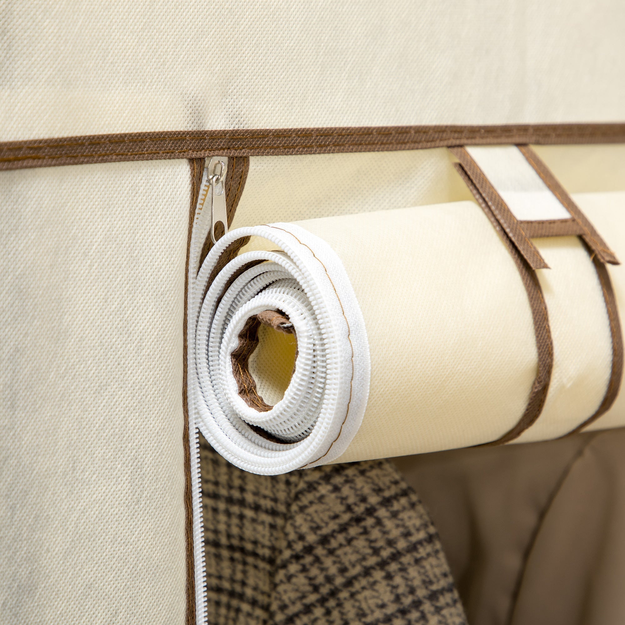 Beige fabric roll with white elastic edge and brown trim secured by zipper for homcom fabric wardrobe with hanging rail and coated steel frame