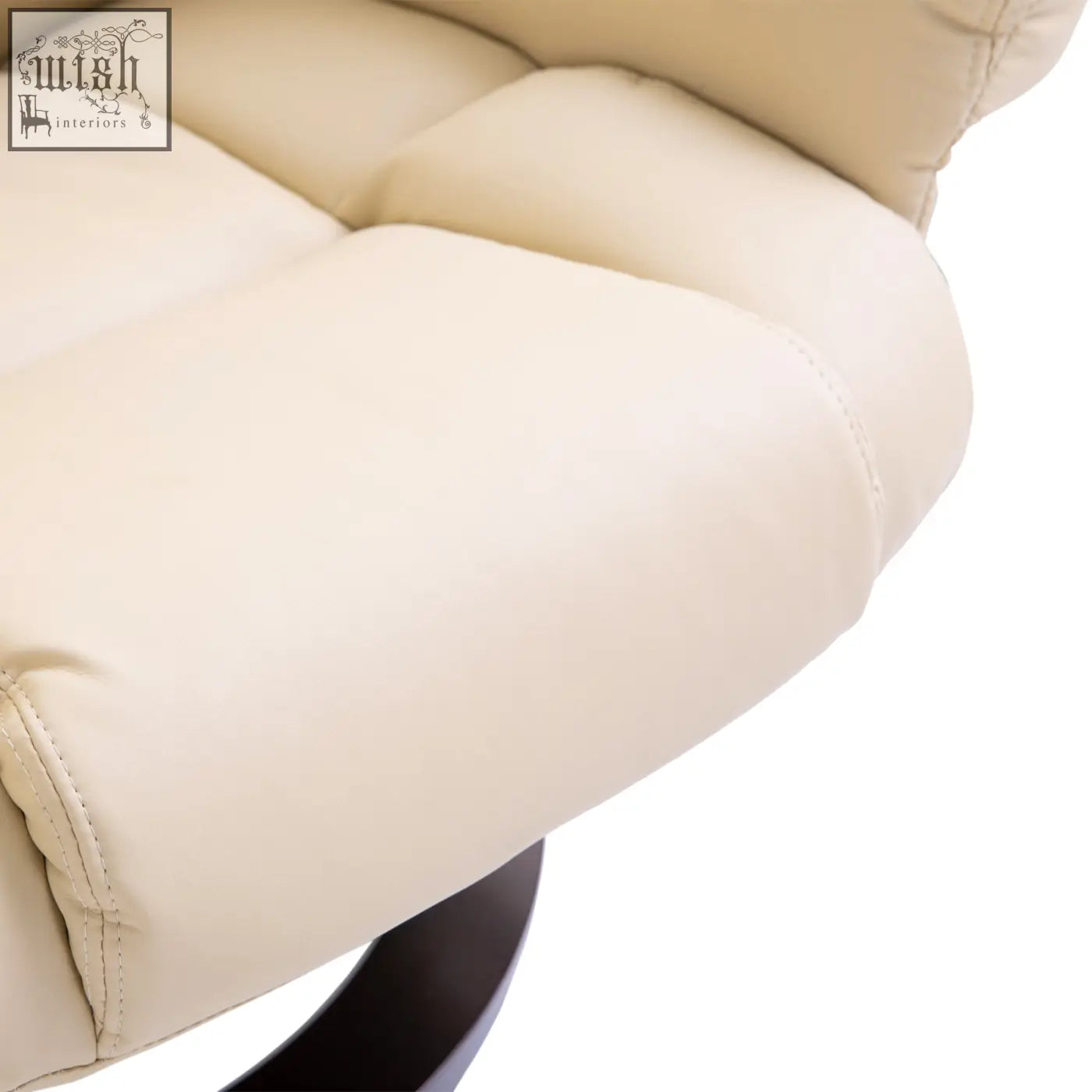 Cream-colored plush cushioned recliner chair with tufted faux leather upholstery and solid wood base for living room