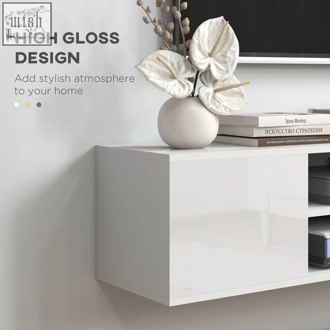 White high-gloss ceramic vase with white anthurium flowers on homcom floating tv stand cabinet with open shelves and storage space