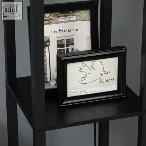 Black framed minimalist line drawing of a dove with picasso signature shown with homcom floor lamp with two shelves and chain switch