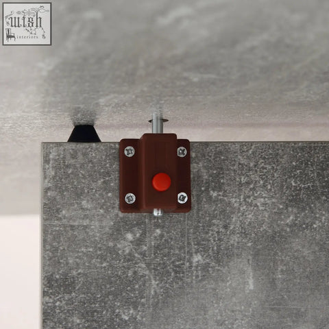 Brown emergency stop button on gray wall near homcom cement grey folding dining table with drop leaf and shelves