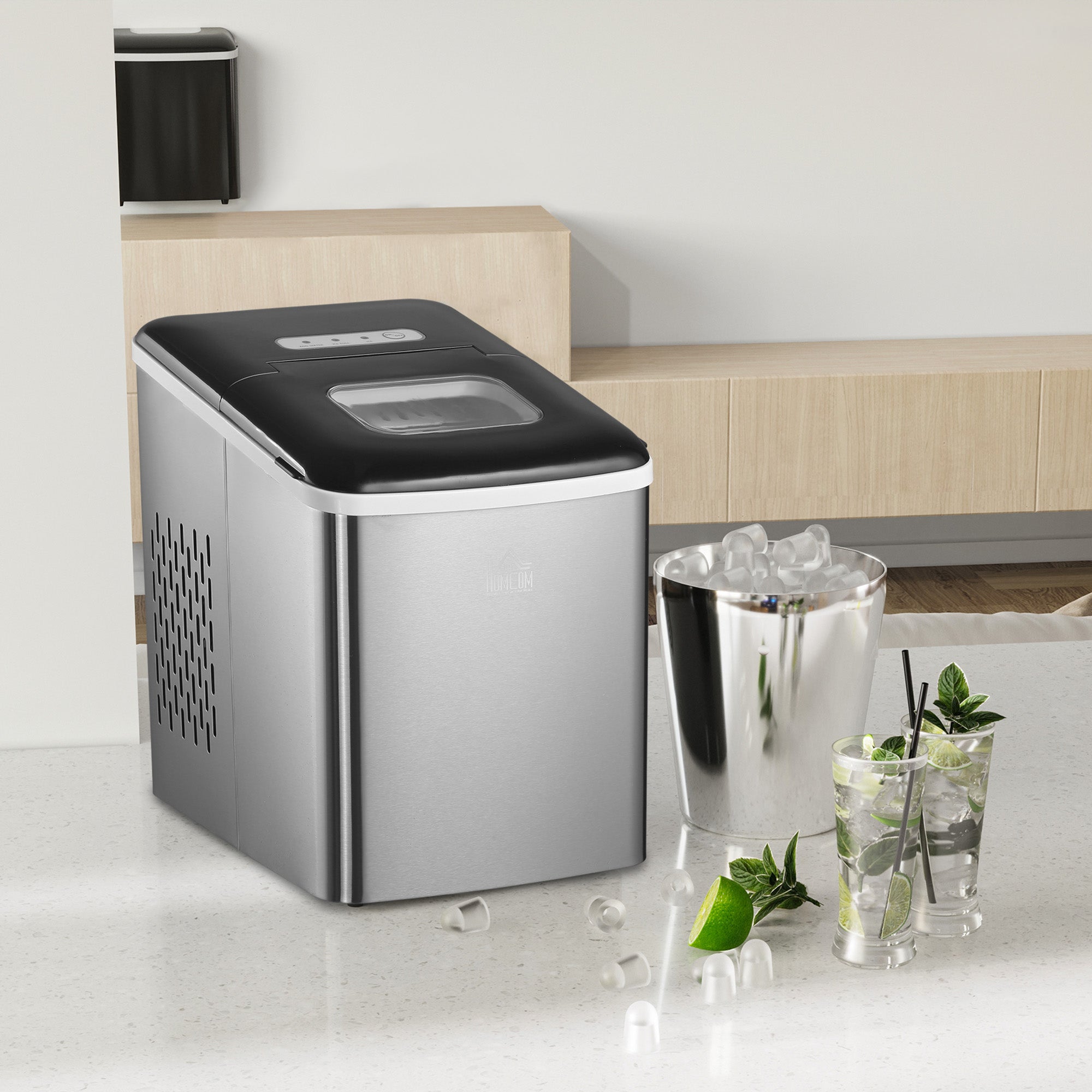 HOMCOM silver and black stainless steel ice maker with bullet shaped ice cubes making 9 cubes per 8 minutes on countertop