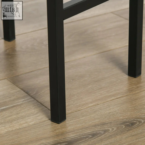 Black metal chair leg with square profile and matte finish on rustic brown particle board seats of homcom bar stools