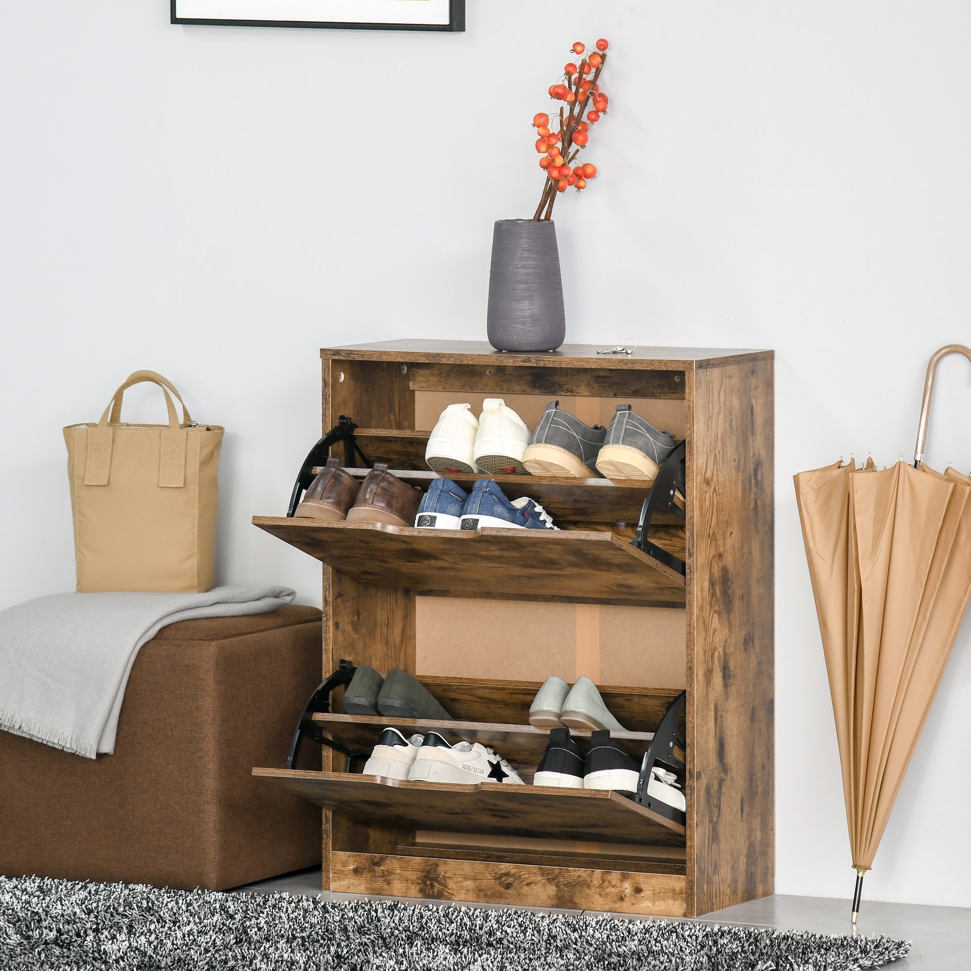 Rustic brown shoe cabinet with three pull-out shelves and gray vase on top made of particle board for entryway storage