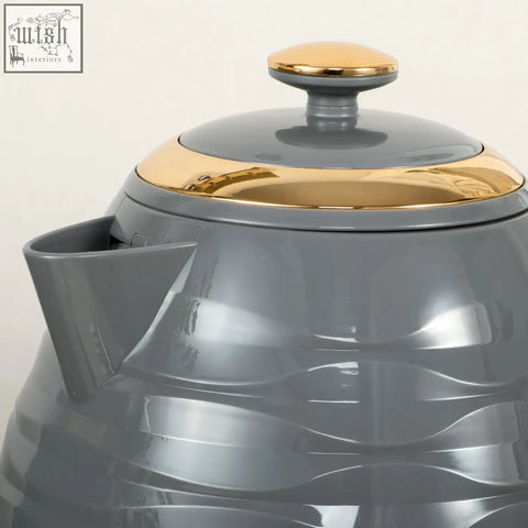 Gray homcom rapid boil kettle with gold lid and handle featuring a glossy wavy textured body and 1.7l capacity
