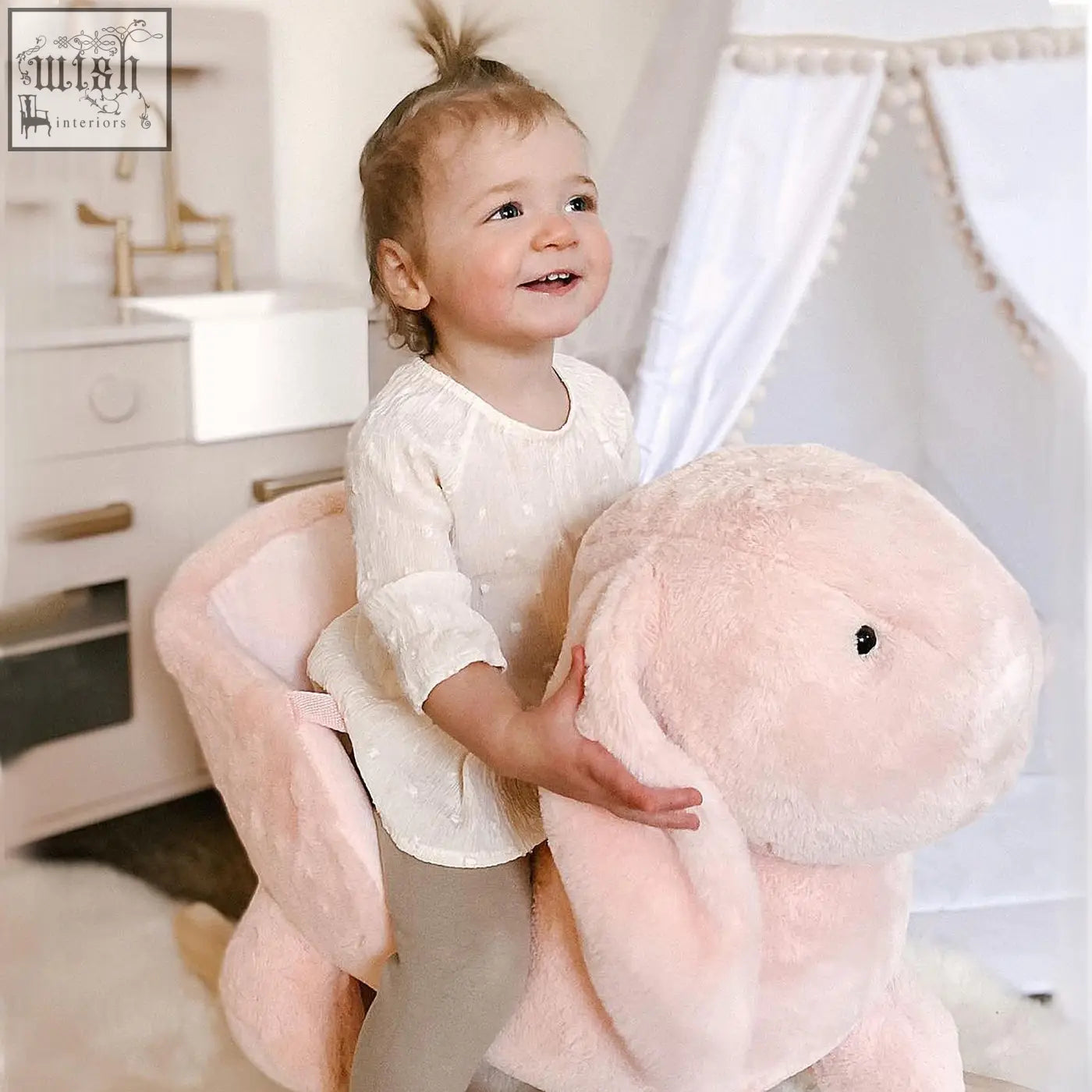 Soft pink plush rocking horse bunny toy with floppy ears wood base sound button and safety belt for toddlers