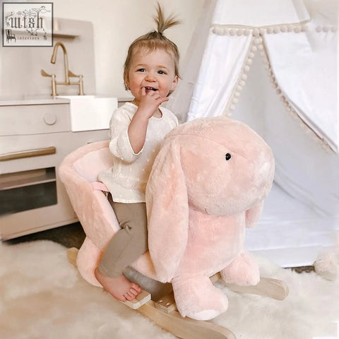 Soft pink plush bunny kids rocking horse with sound button and wood base seat for toddler ride on toy
