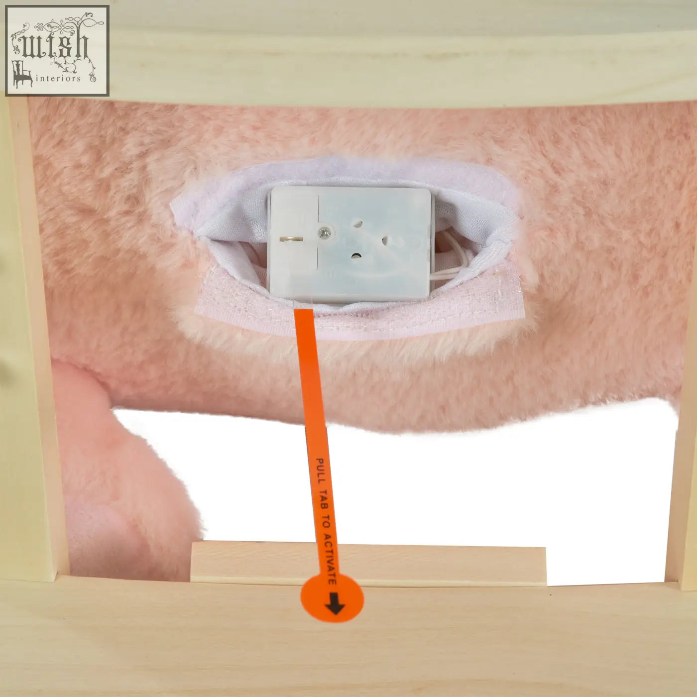 White rectangular electrical outlet cover with orange pull tab for activation on the back of homcom rocking horse with wood base and sound button