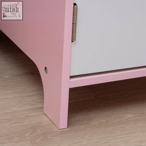Pink painted wooden cabinet with silver hinge and rounded base from homcom kids desk and chair set for toddlers