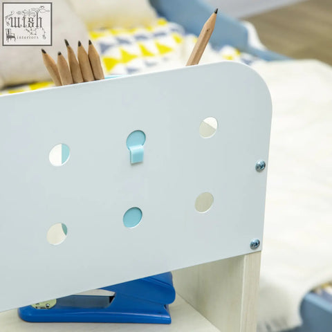 White plastic pencil holder with light blue cutouts and clip for homcom kids desk and chair set with curved backrest