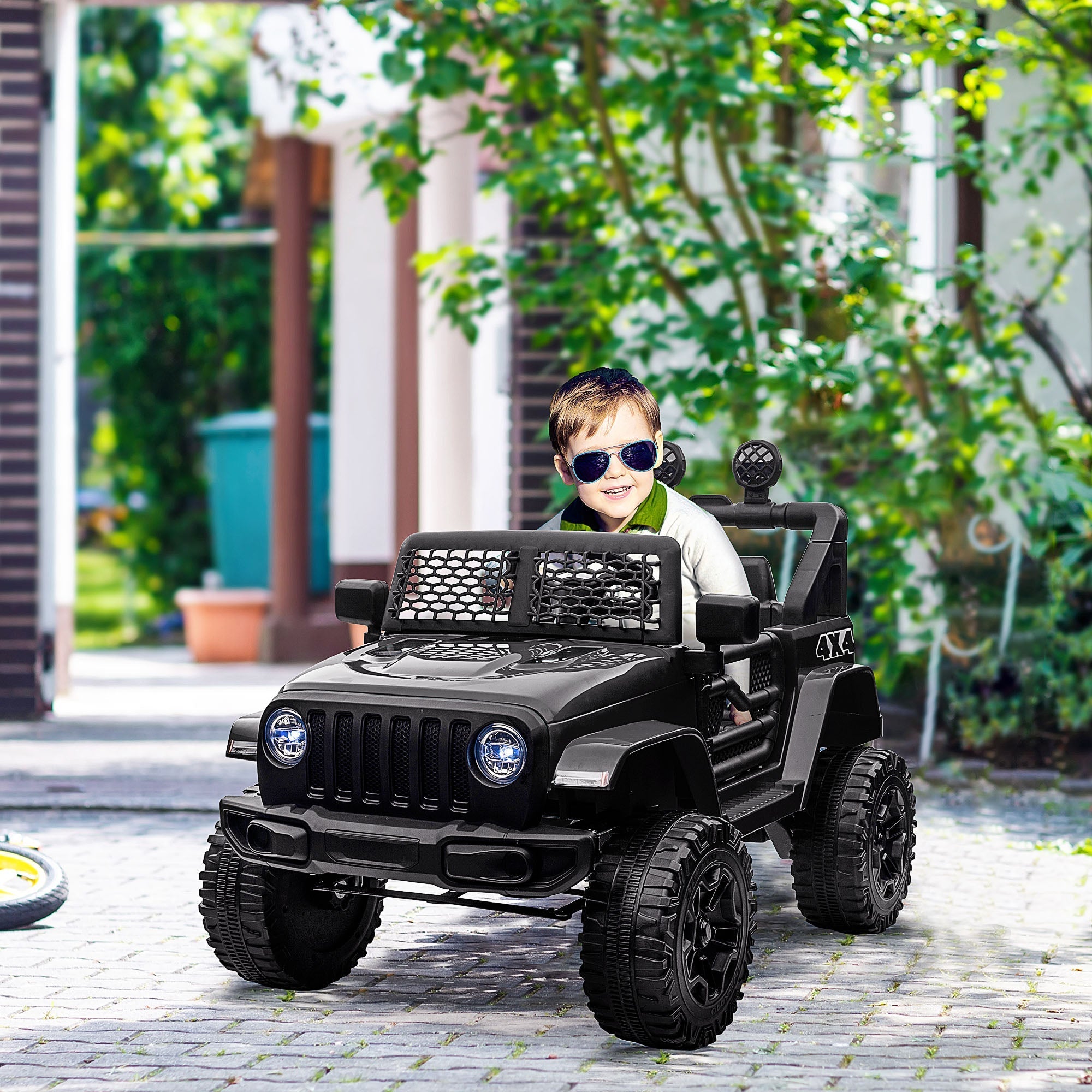 Black homcom kids electric ride on jeep with rugged extra-wide tyres mesh grille seat belt and remote control features