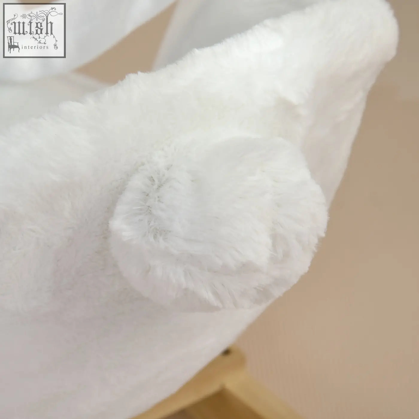A white plush fuzzy hat on the homcom kids rabbit-shaped rocking horse with safety belt and realistic sounds