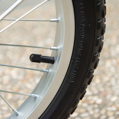 Black rubber tire valve cap with textured grip on pink homcom kids scooter wheel with adjustable handlebar and dual braking