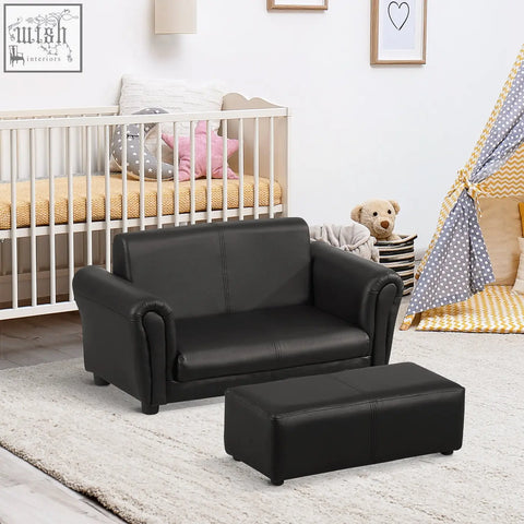 Black faux leather kids twin sofa with matching footstool designed for boys and girls with high weight capacity