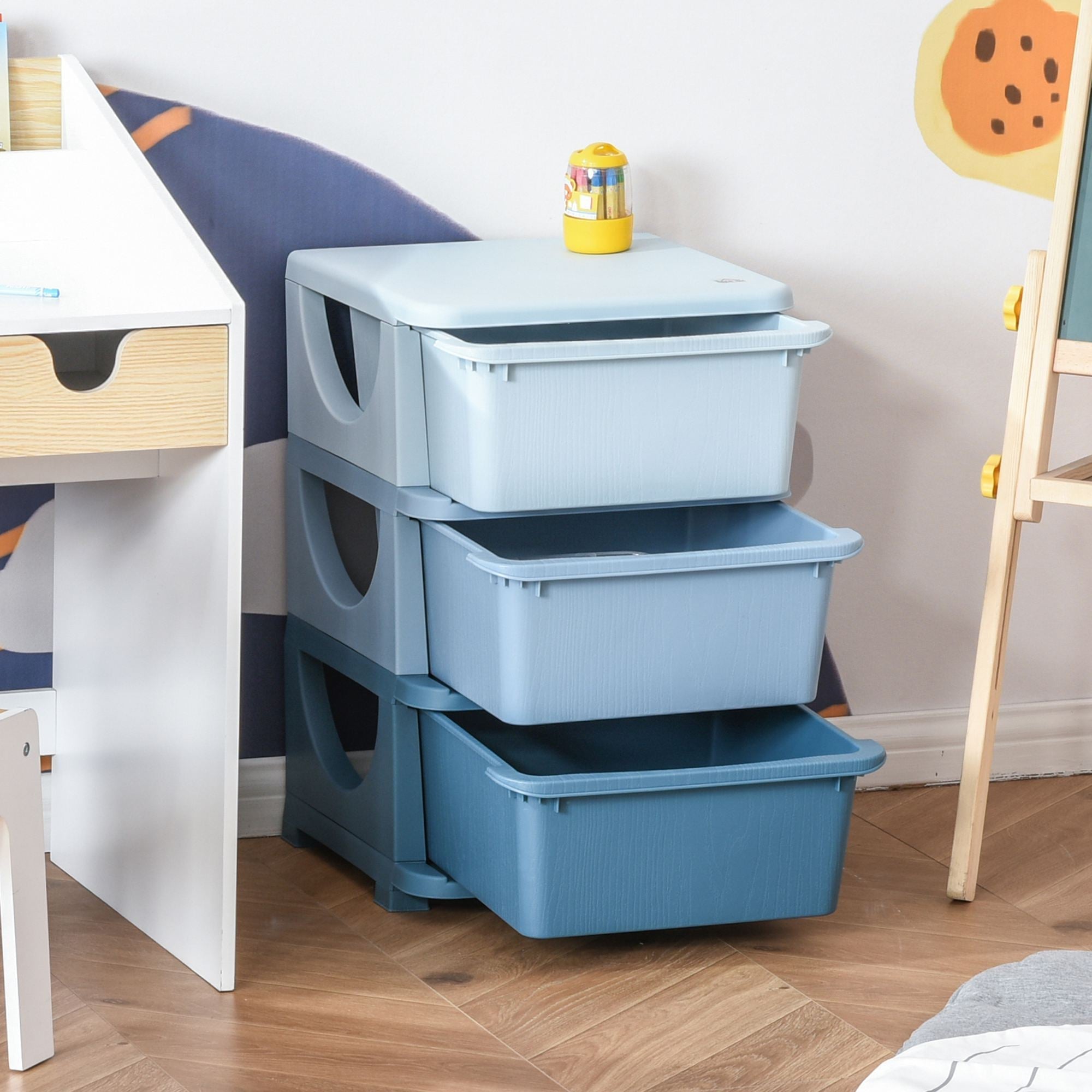 Stacked kids storage unit with three drawers in light and dark blue plastic featuring stump feet and side handles