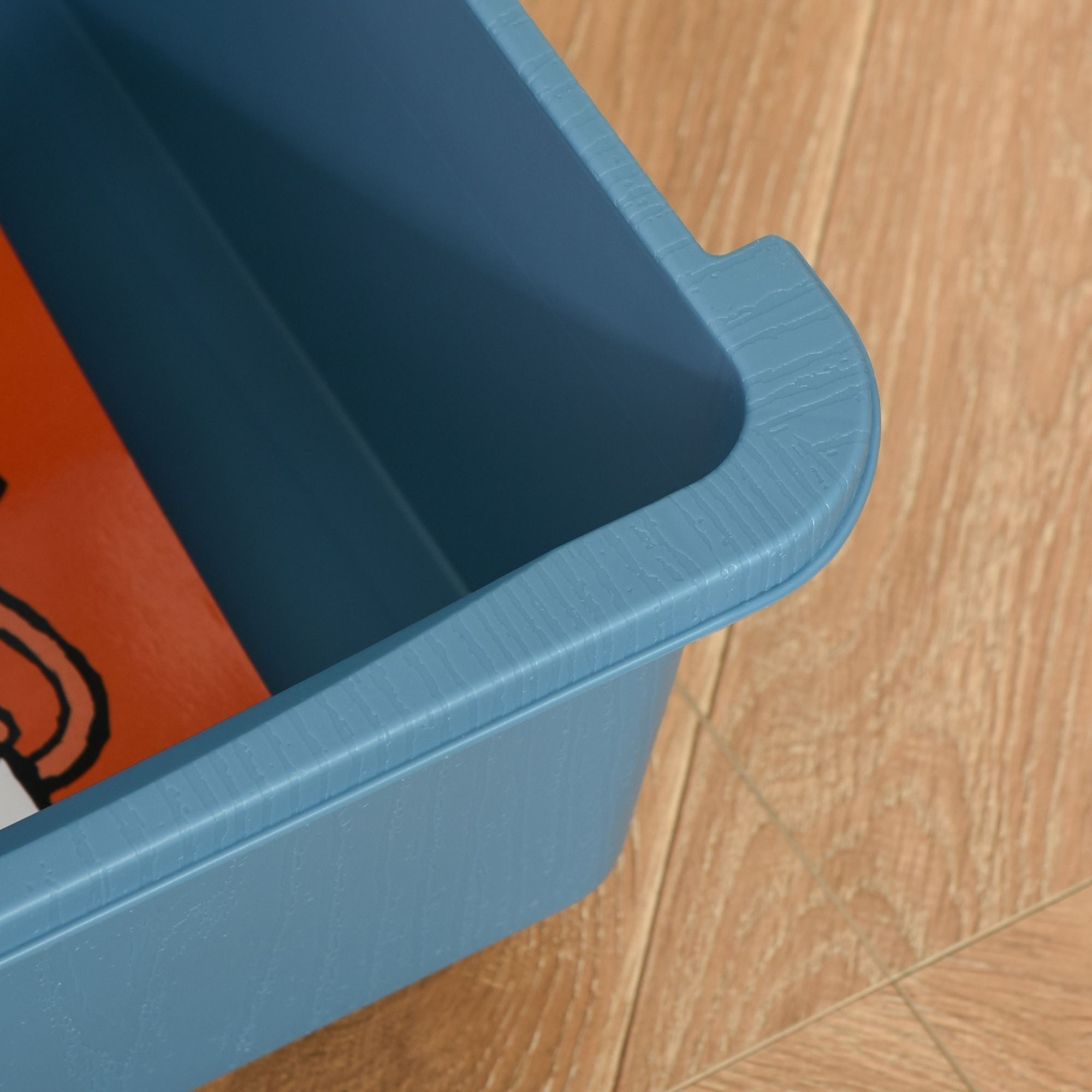 Blue plastic kids storage bin with three drawers textured rim rounded corners and sturdy stump feet for nursery use