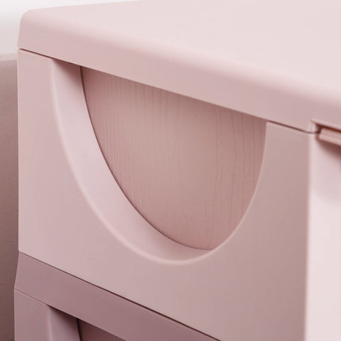Pastel pink plastic kids storage box with three drawers and stump feet for nursery and playroom organization
