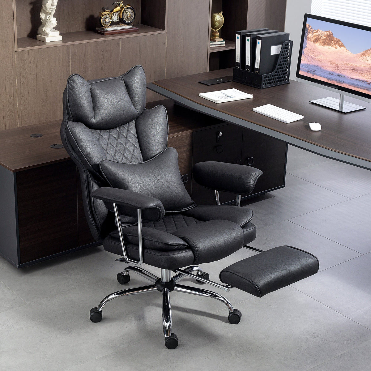 Black leathaire office chair with quilted design chrome base and lumbar support pillow for ergonomic comfort