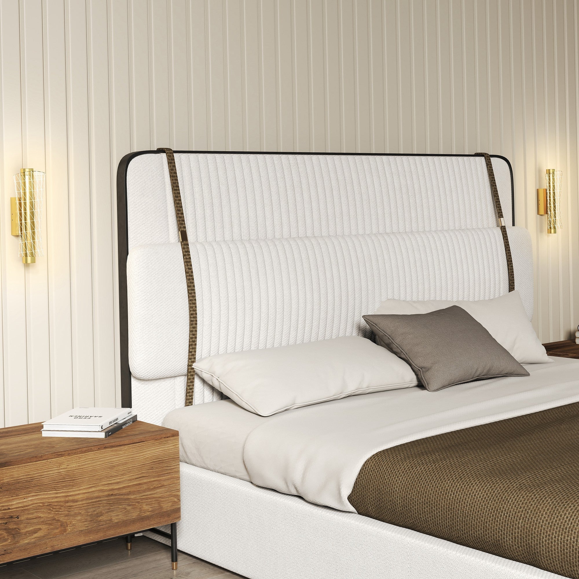 White tufted upholstered bed with black metal frame and brown woven straps next to gold tone geometric mesh led wall lamp for living room