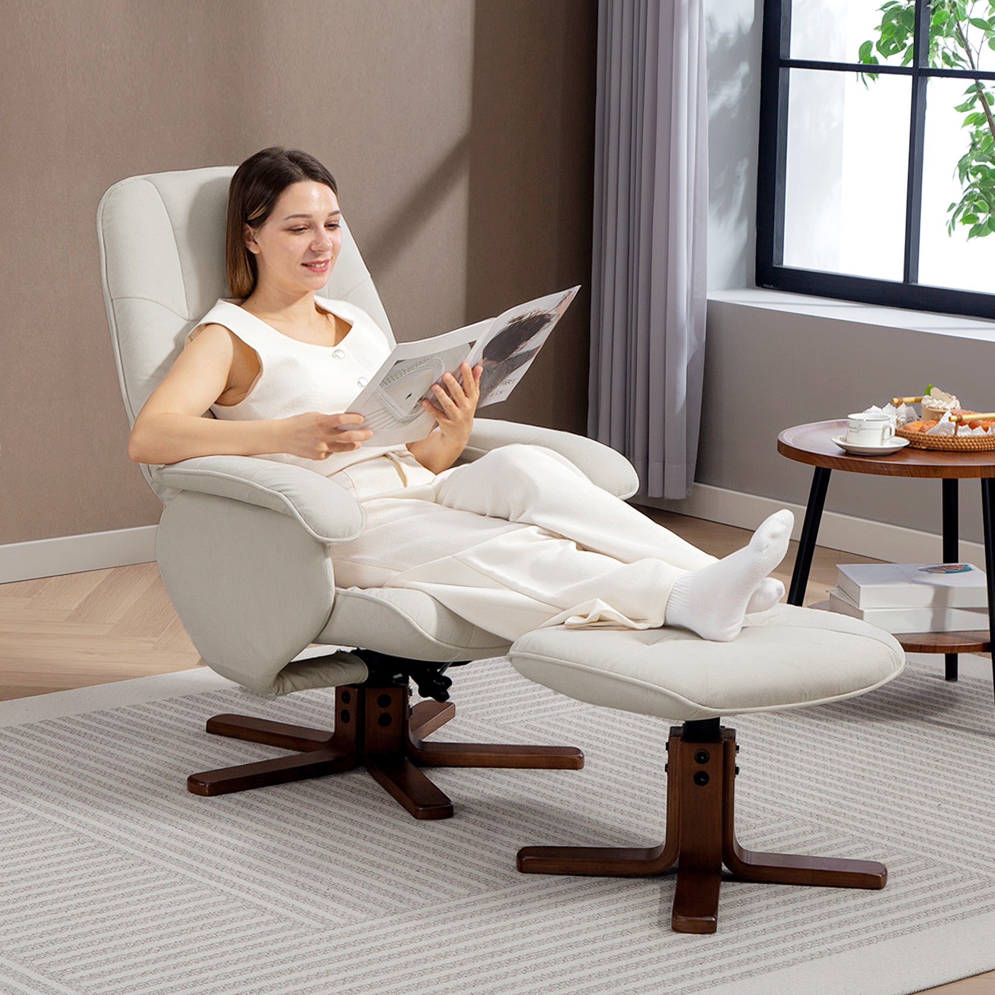 Cream-colored linen-look recliner chair with wooden bases and matching ottoman for cozy living room seating