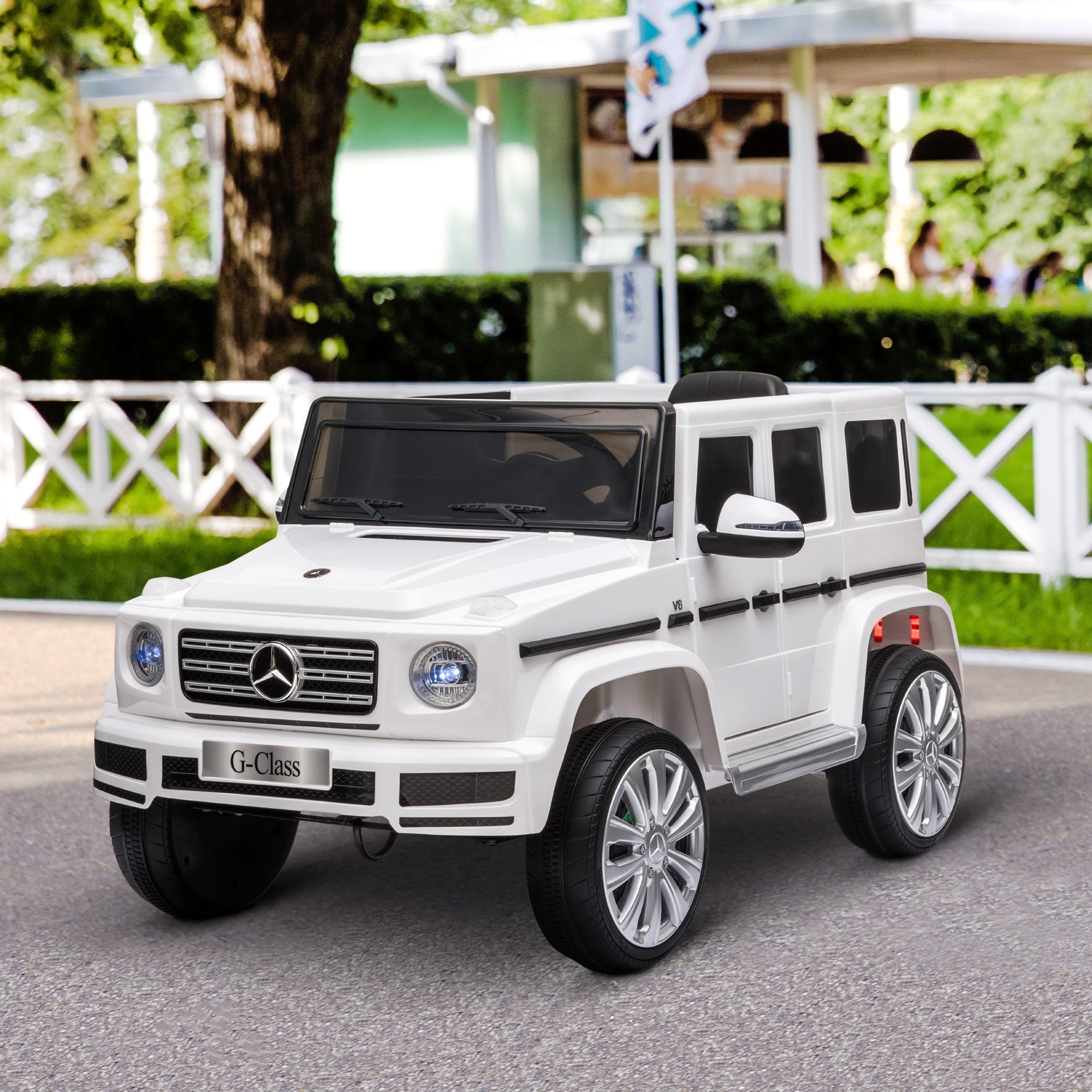 White mercedes benz g500 kids electric ride on car with chrome accents black trim parental remote control