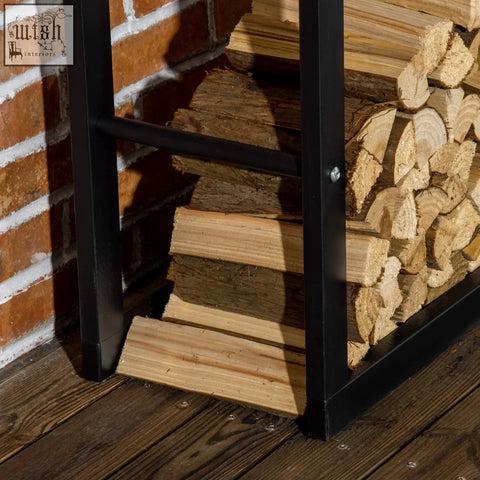 Black metal firewood rack holding neatly stacked logs with design allows easy wood storage for indoor outdoor use