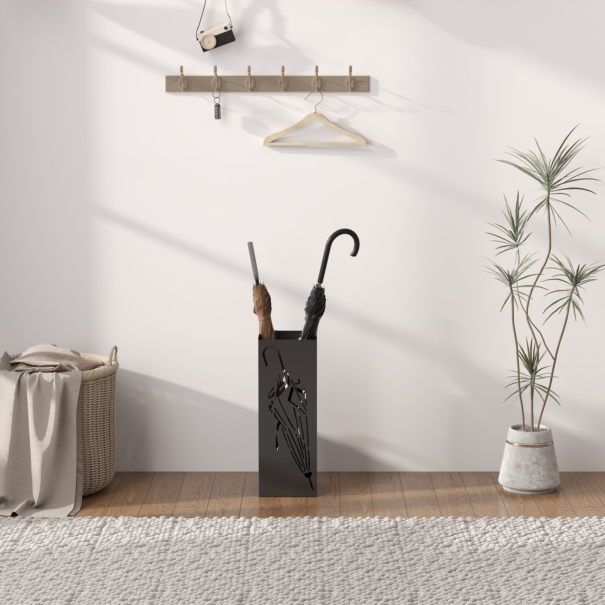Black metal umbrella stand with abstract cutout design removable drip tray and hooks for umbrella storage in entryway