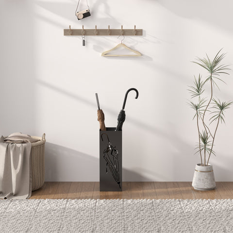 Black metal umbrella stand with abstract cutout design removable drip tray and hooks for umbrella storage in entryway