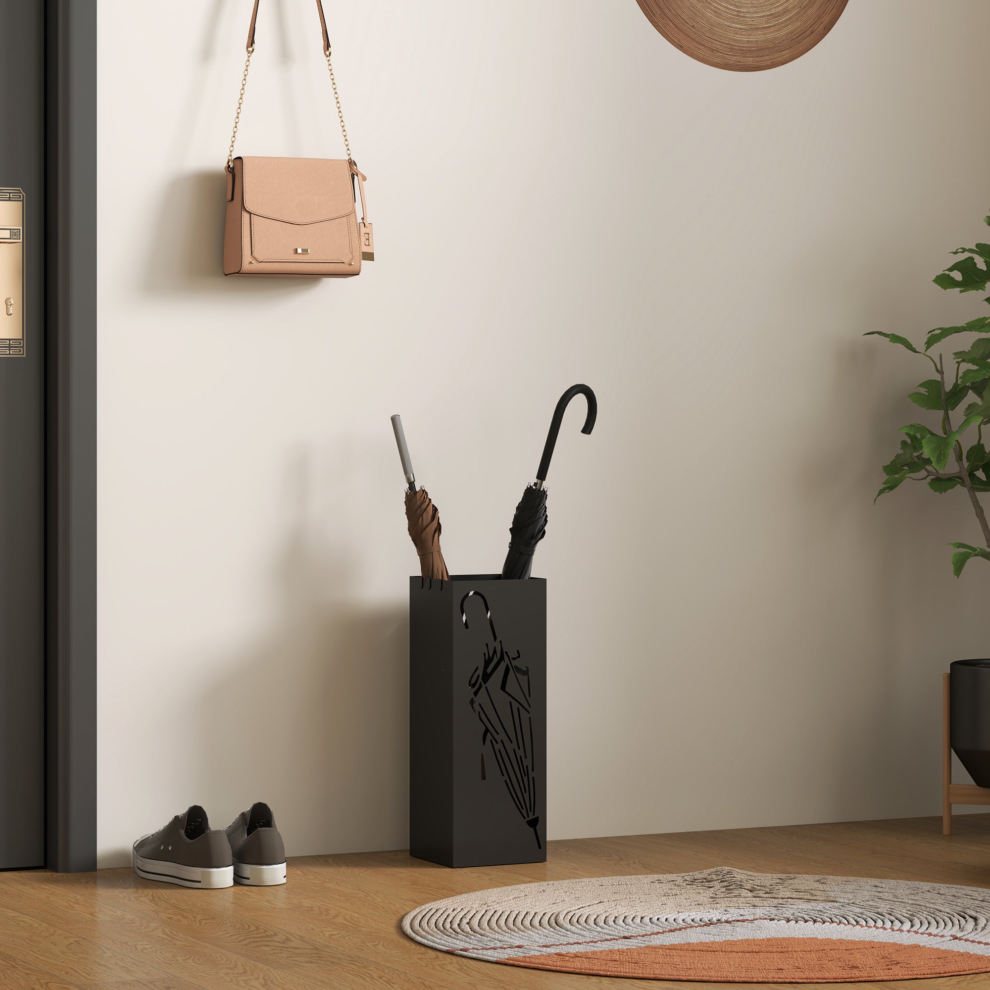 Black metal umbrella stand with minimalist open umbrella cutout and removable drip tray for umbrella storage