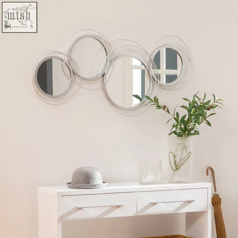 Silver framed metal wall art with circular overlapping mirrors hanging kit perfect for living room decor