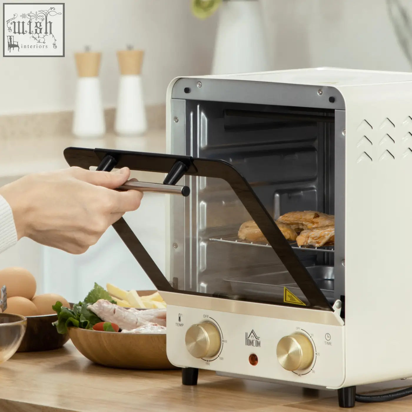 Cream white homcom mini oven with black glass door, gold knobs, crumb tray, baking tray, and 15 litre capacity