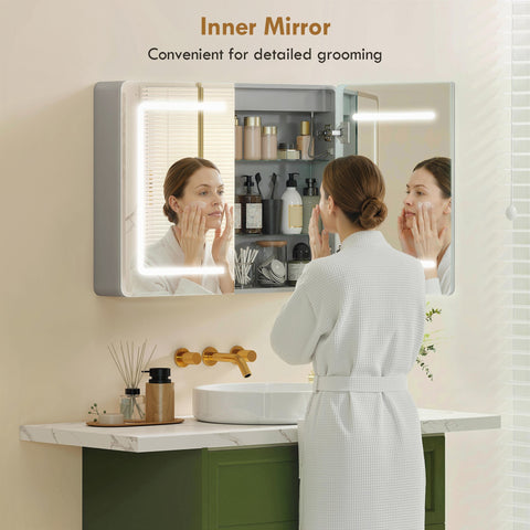 Modern rectangular silver framed bathroom mirror cabinet with tempered glass doors and integrated led lighting interior