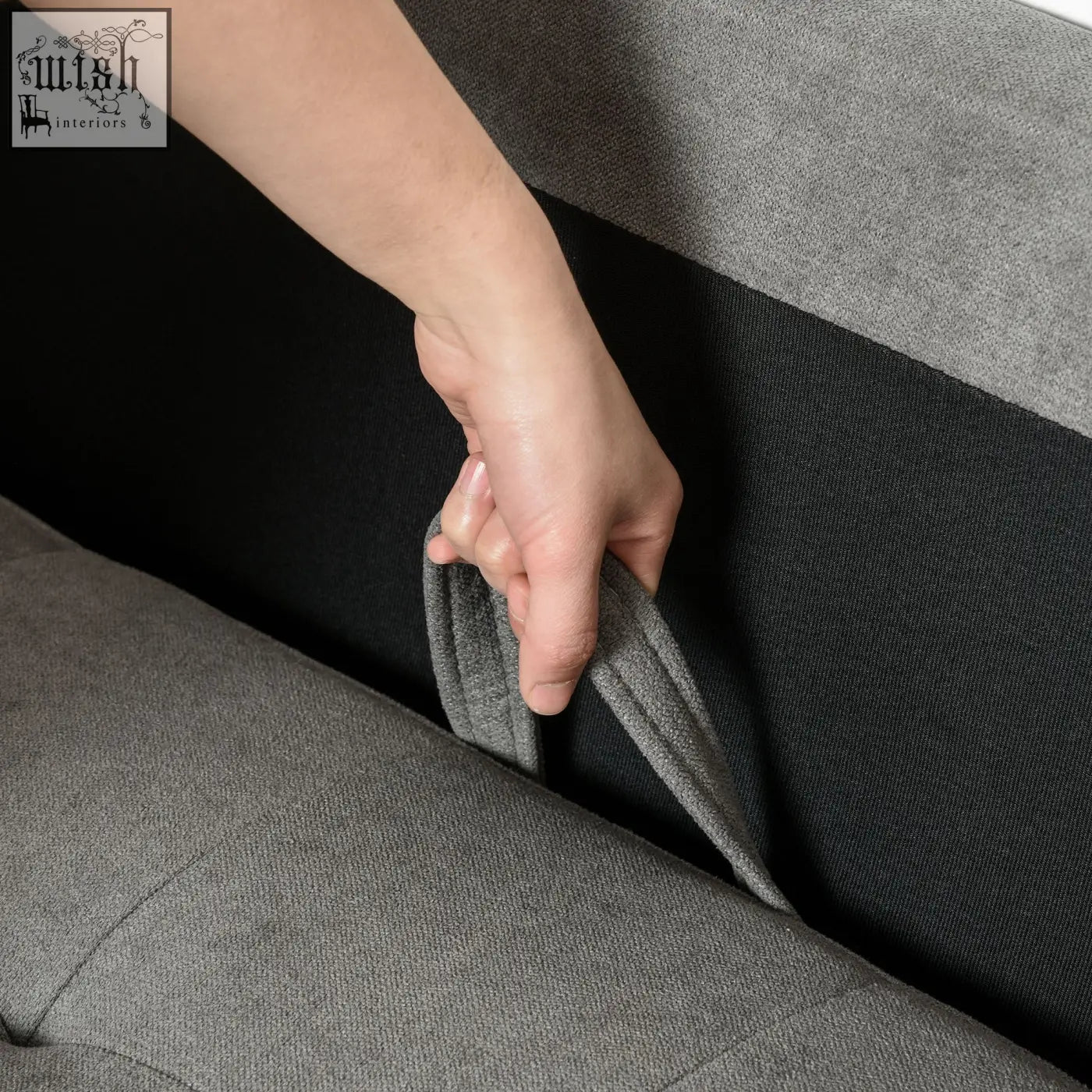 Hand pulling hidden storage handle on gray tufted cotton homcom modern 3 seater sofa armrest with wood legs