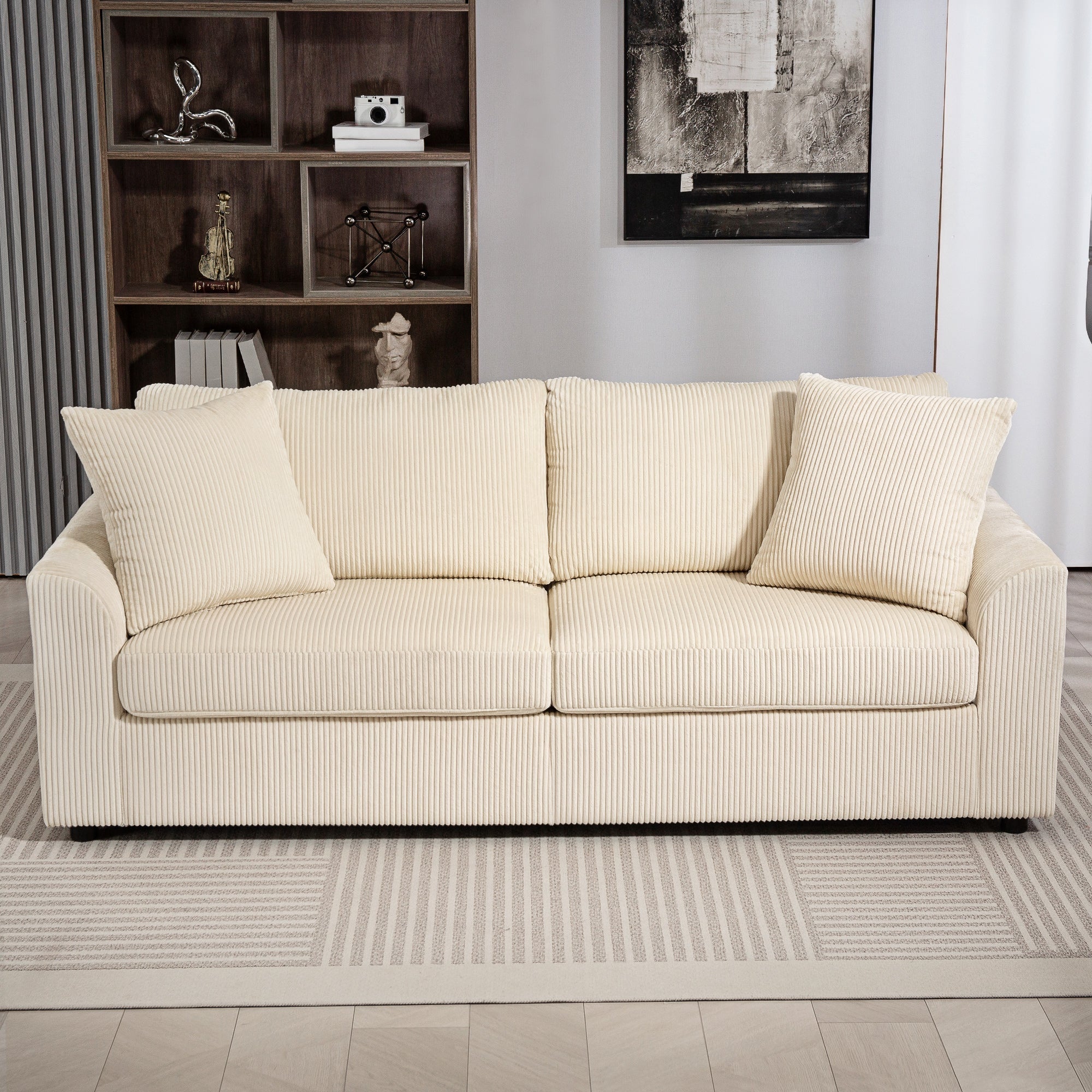 Cream seater sofa with vertical ribbed corduroy fabric spring pack and matching scatter cushions for living room