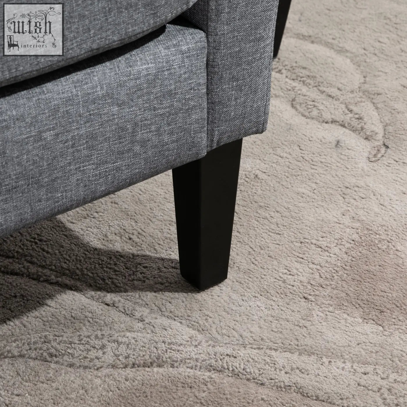 Gray textured fabric occasional chair with black rubber wood tapered legs for a comfy sitting experience
