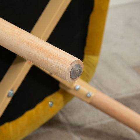 Light-colored wooden leg with clear plastic cap on yellow homcom tufted wingback chair for living room use