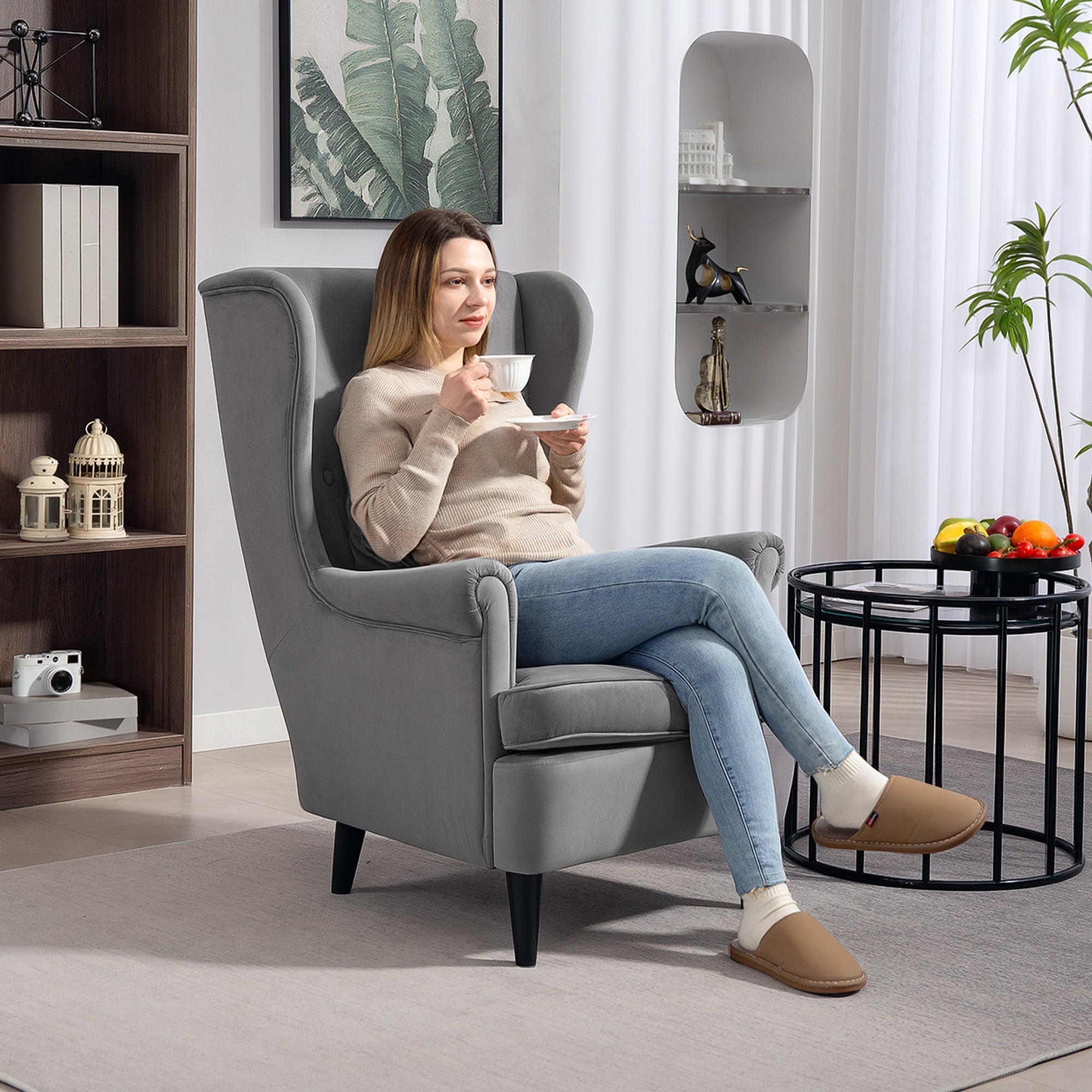 Gray wingback armchair with high wingback design, washable pillow cover, velvet-feel fabric, and solid wood legs