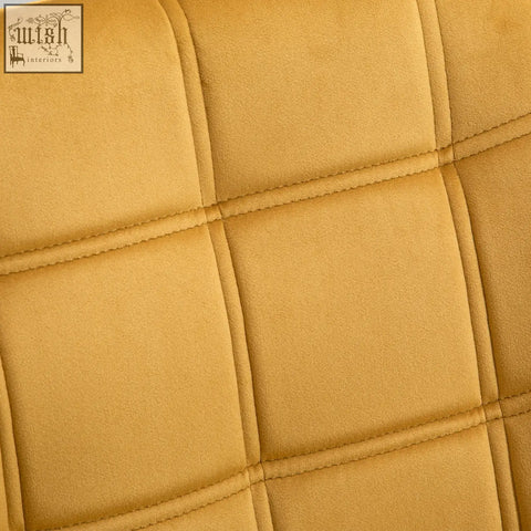 Mustard yellow velvet-feel upholstery with quilted stitching on a homcom modern armchair with wide arms and rubber wood legs