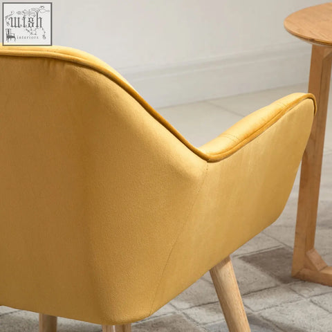 A mustard-yellow HOMCOM modern armchair with velvet-feel upholstery, wide arms, and rubber wood legs for living room use