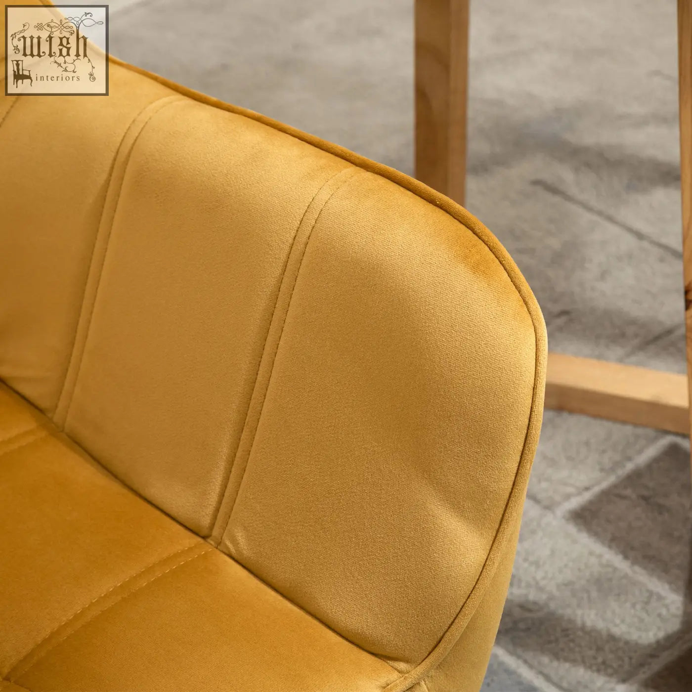 A mustard yellow HOMCOM modern armchair with velvet-feel upholstery wide arms and rubber wood legs for living room use