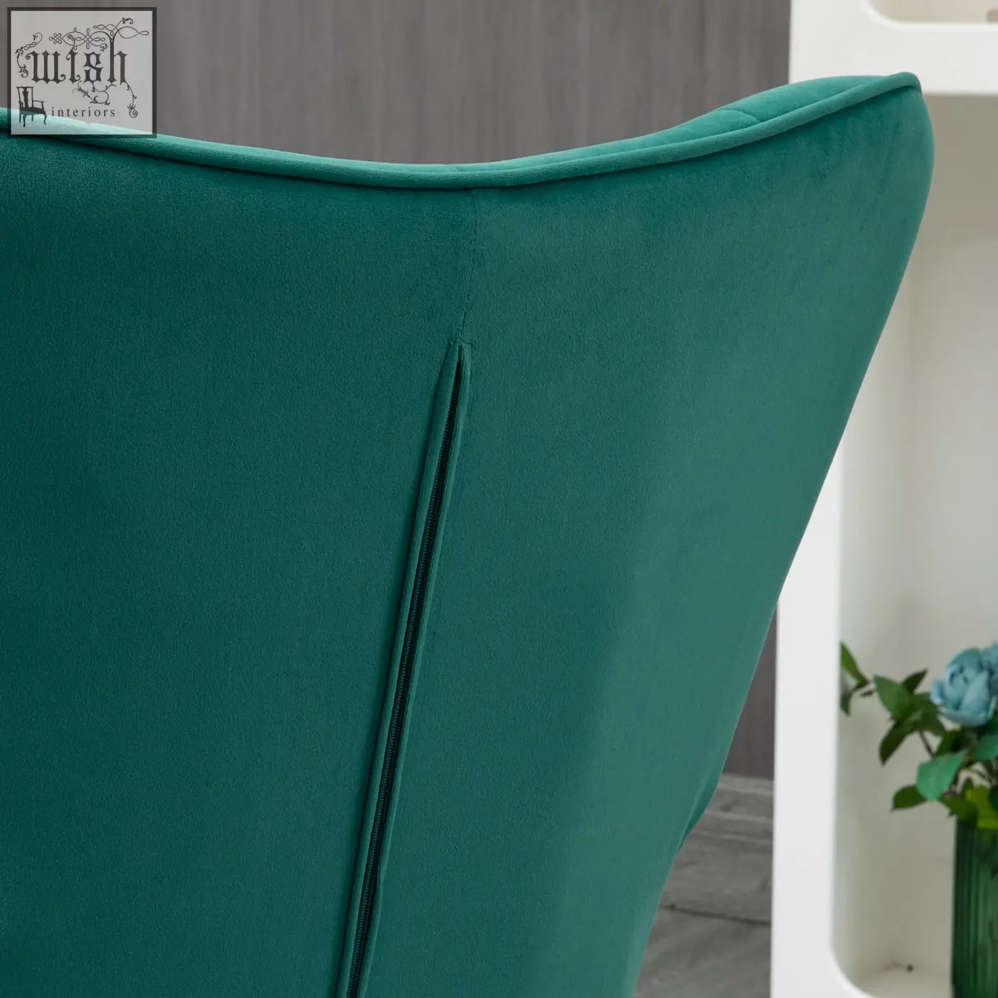Back of dark green emerald velvet wingback chair with subtle seam zipper and steel legs from homcom armchair set