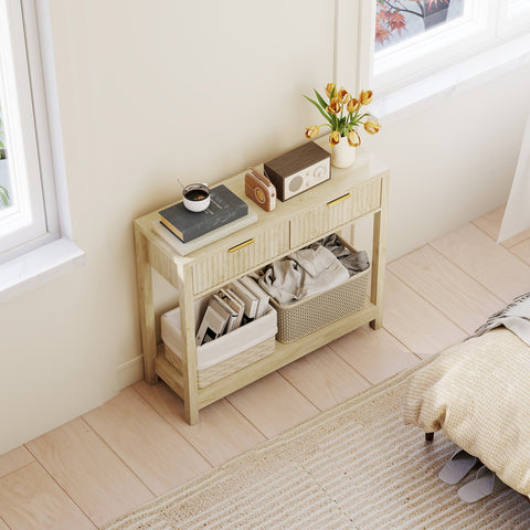 Light wood console table with fluted panel drawers and woven wicker baskets for entryway storage in natural finish