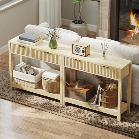 Light wood console table with fluted panel drawers and gold handles with wicker baskets on lower shelf natural finish