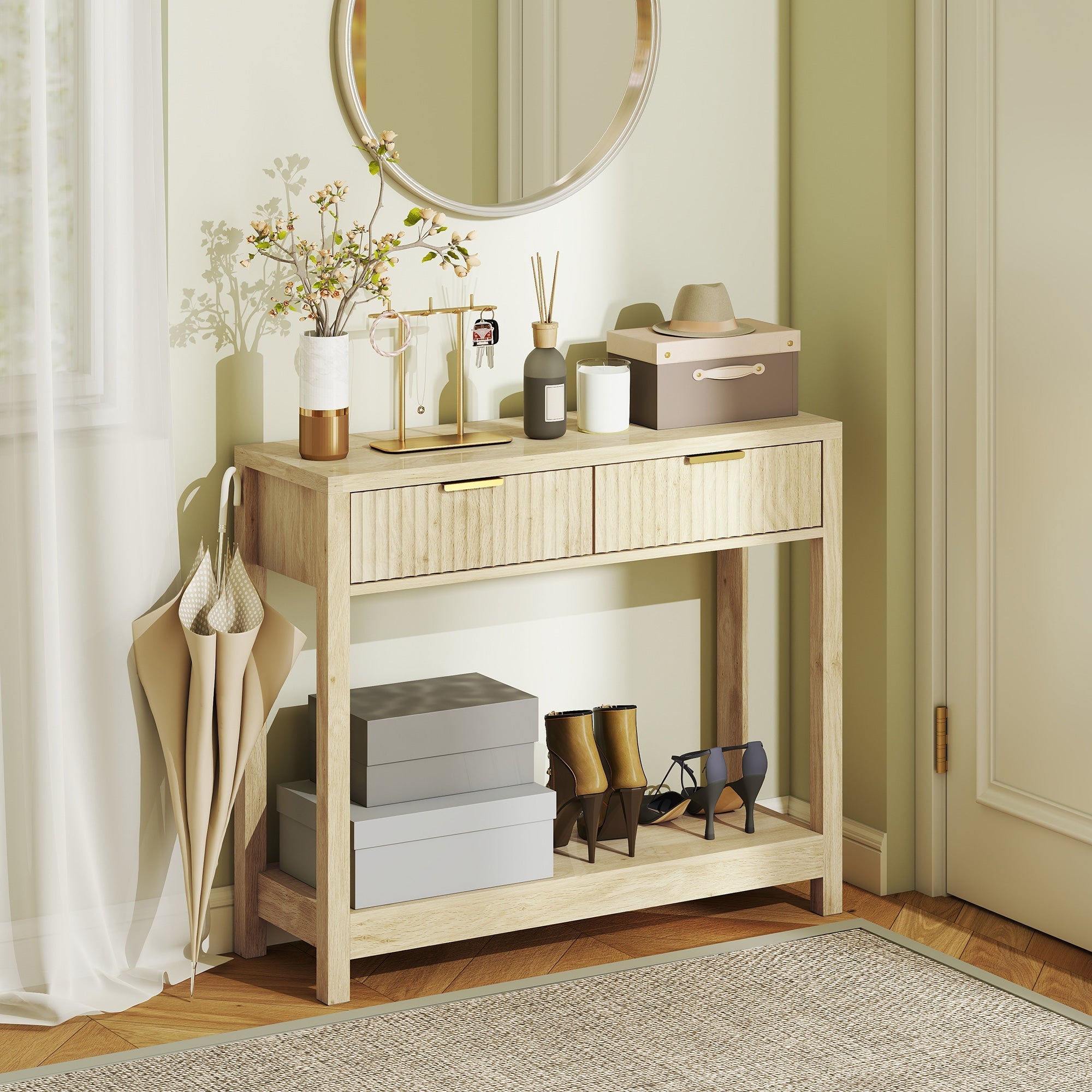 Light wood console table with fluted panel drawers gold-tone handles and open shelf for entryway or living room use