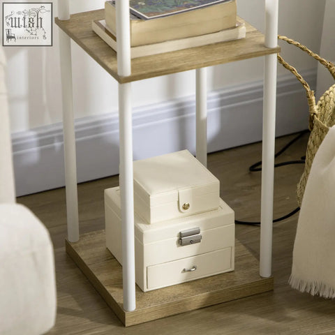 Two cream jewelry boxes with metal clasps sit on a wooden side table under a white homcom floor lamp with pull chain and 26l x 26w shelves