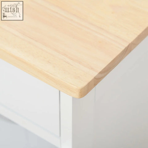 Modern kitchen trolley with light wooden countertop, white frame, and three three-bottle wine rack for storage
