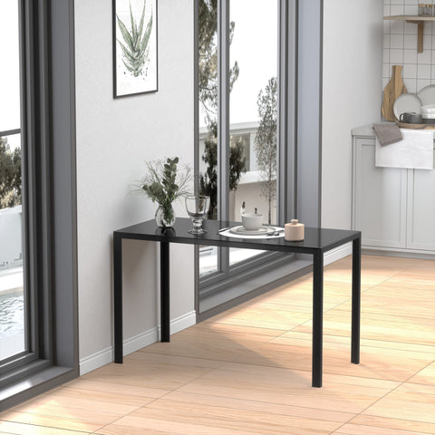 Black rectangular dining table with sleek metal legs and tempered glass top perfect for dinner parties and everyday use
