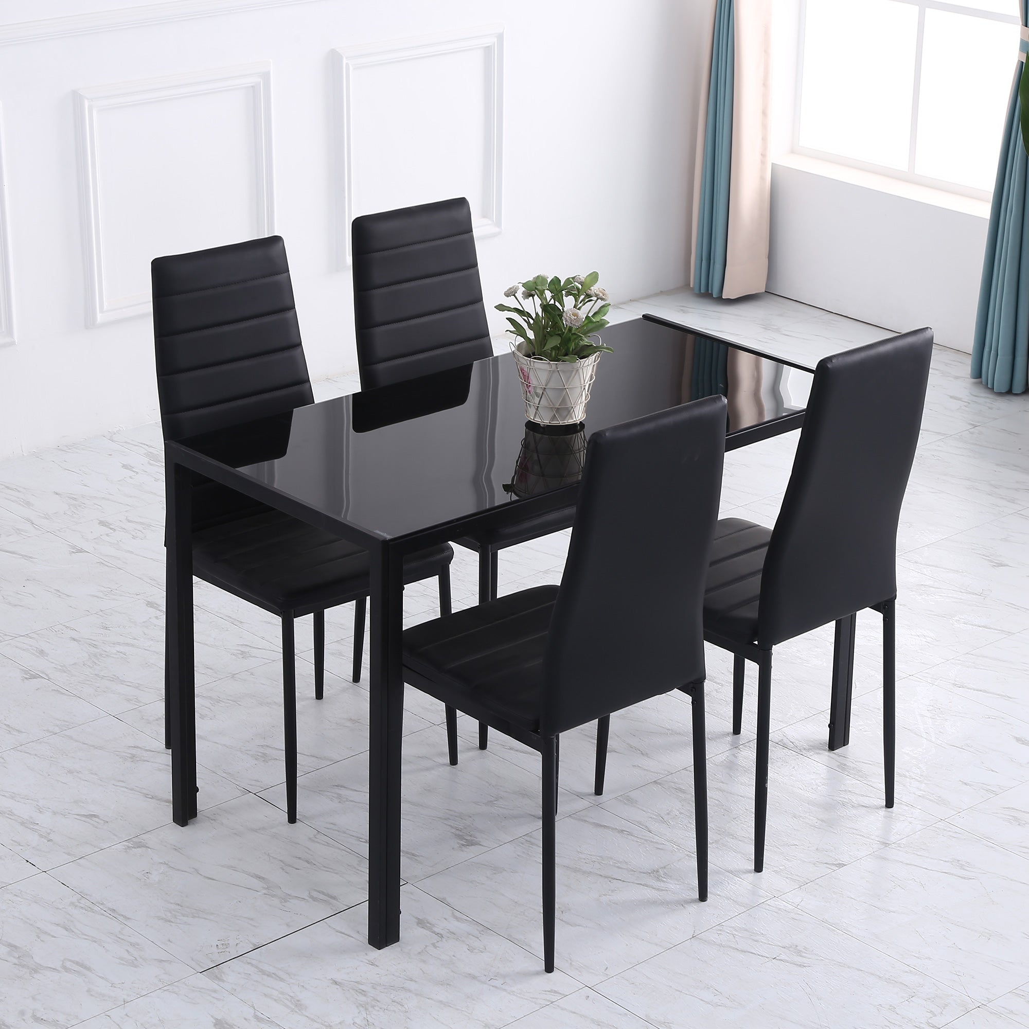 Black glass-top dining table with tempered glass and metal legs ideal for dinner parties and modern dining rooms