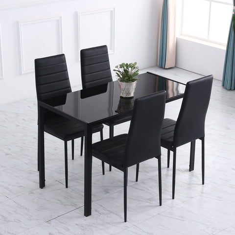 Black glass-top dining table with tempered glass and metal legs ideal for dinner parties and modern dining rooms