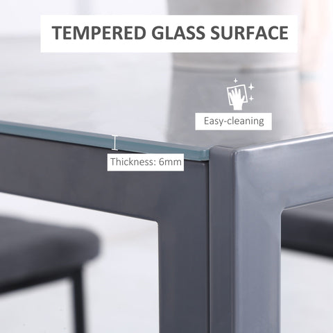 Modern grey dining table with a 6mm tempered glass top and powder coated steel frame for dining room use